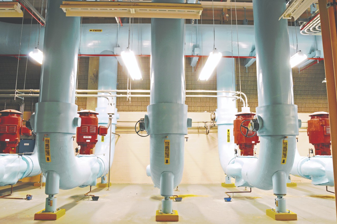 An image of several large Enwave pumps that bring water from the city drinking water system and run it through heat exchangers